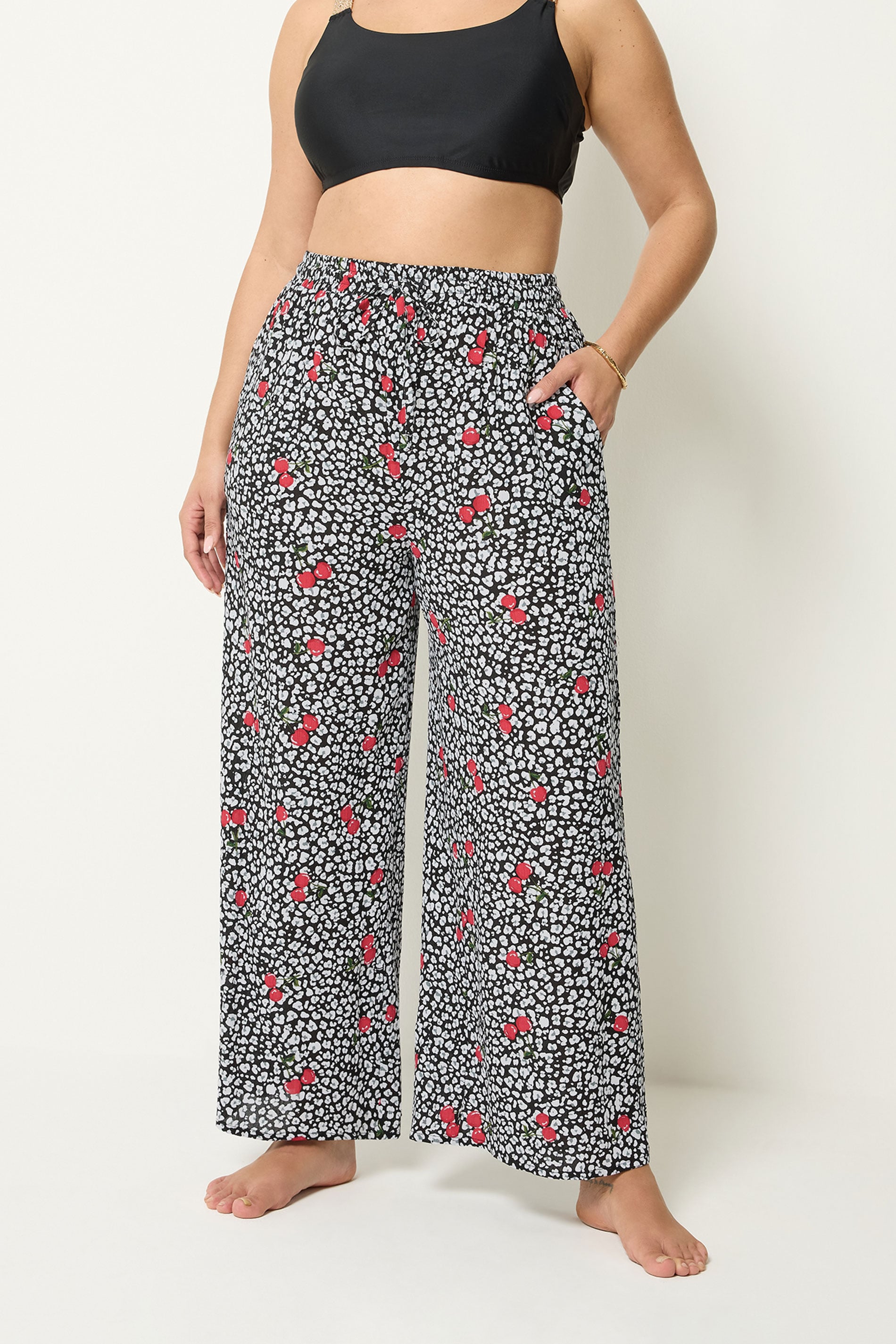 YOURS Plus Size Black Leopard & Cherry Print Crinkle Beachwear Wide Leg Trousers | Yours Clothing 1