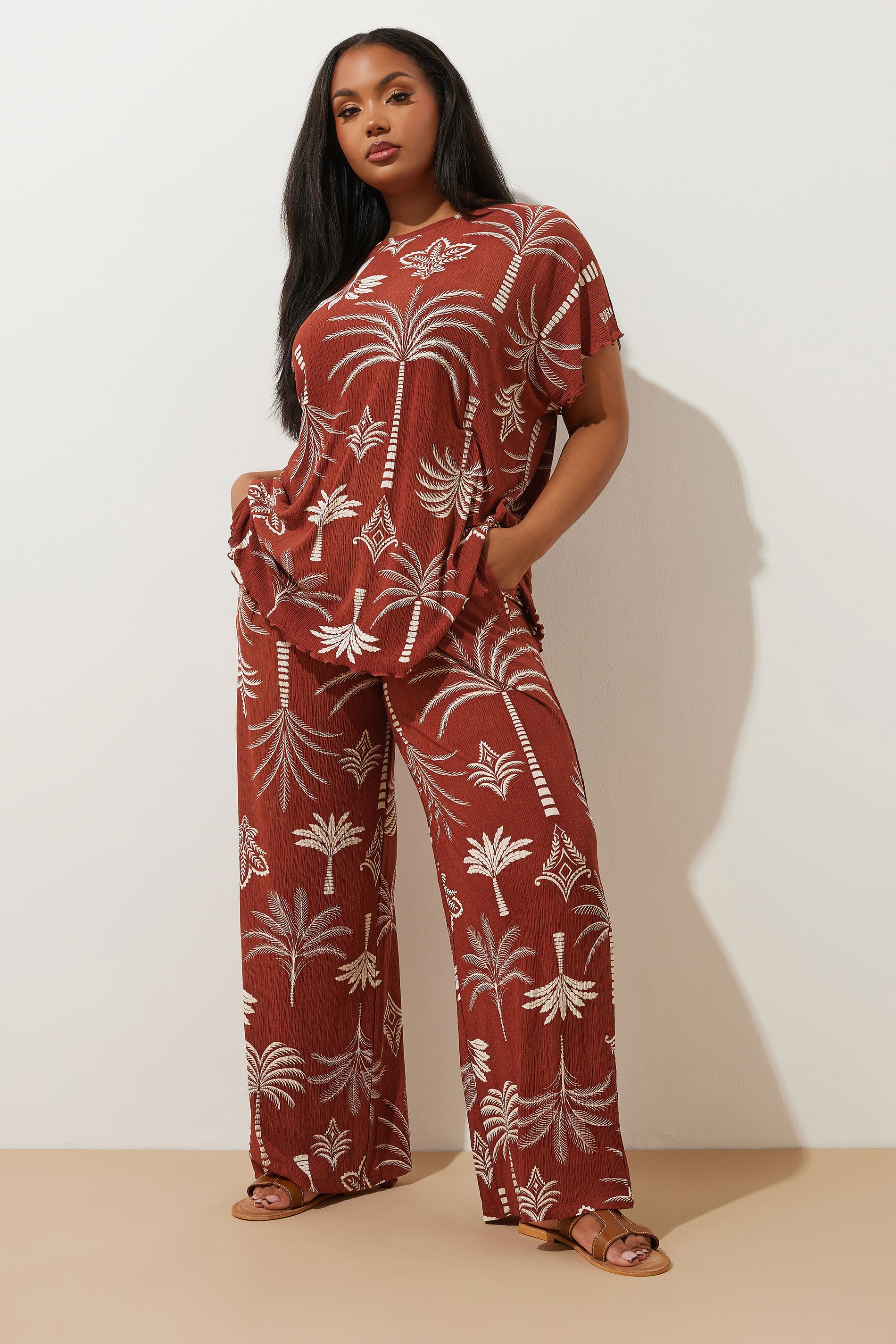 YOURS Plus Size Brown Palm Print Plisse Wide Leg Trousers | Yours Clothing 1