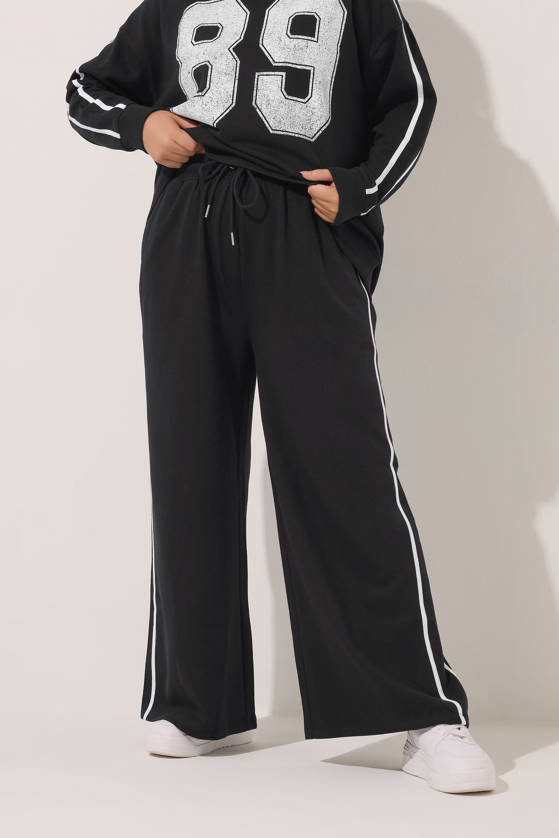 YOURS Plus Size Black Wide Leg Side Stripe Joggers | Yours Clothing 1