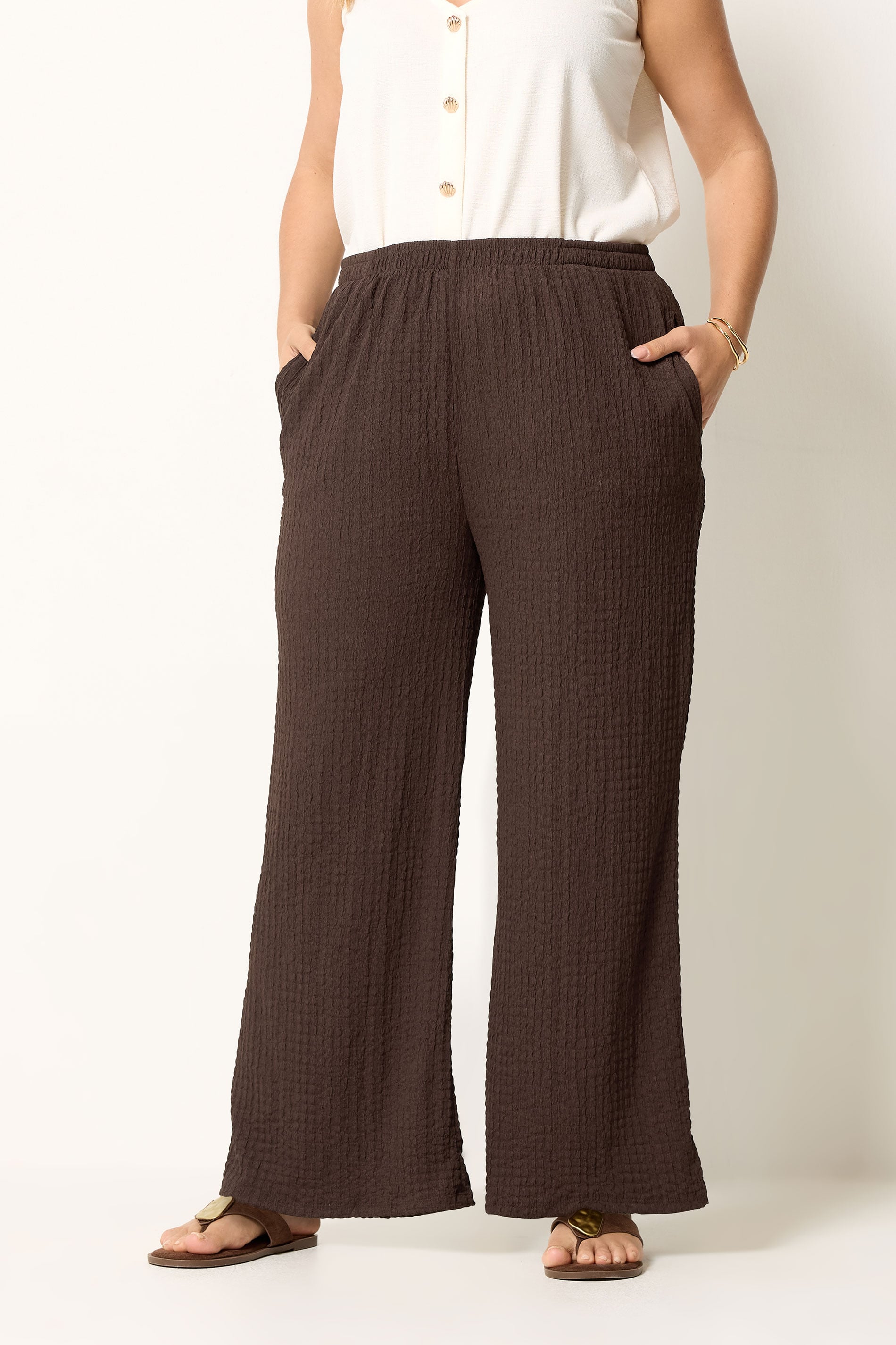 YOURS Plus Size Chocolate Brown Bubble Textured Wide Leg Trousers | Yours Clothing 1