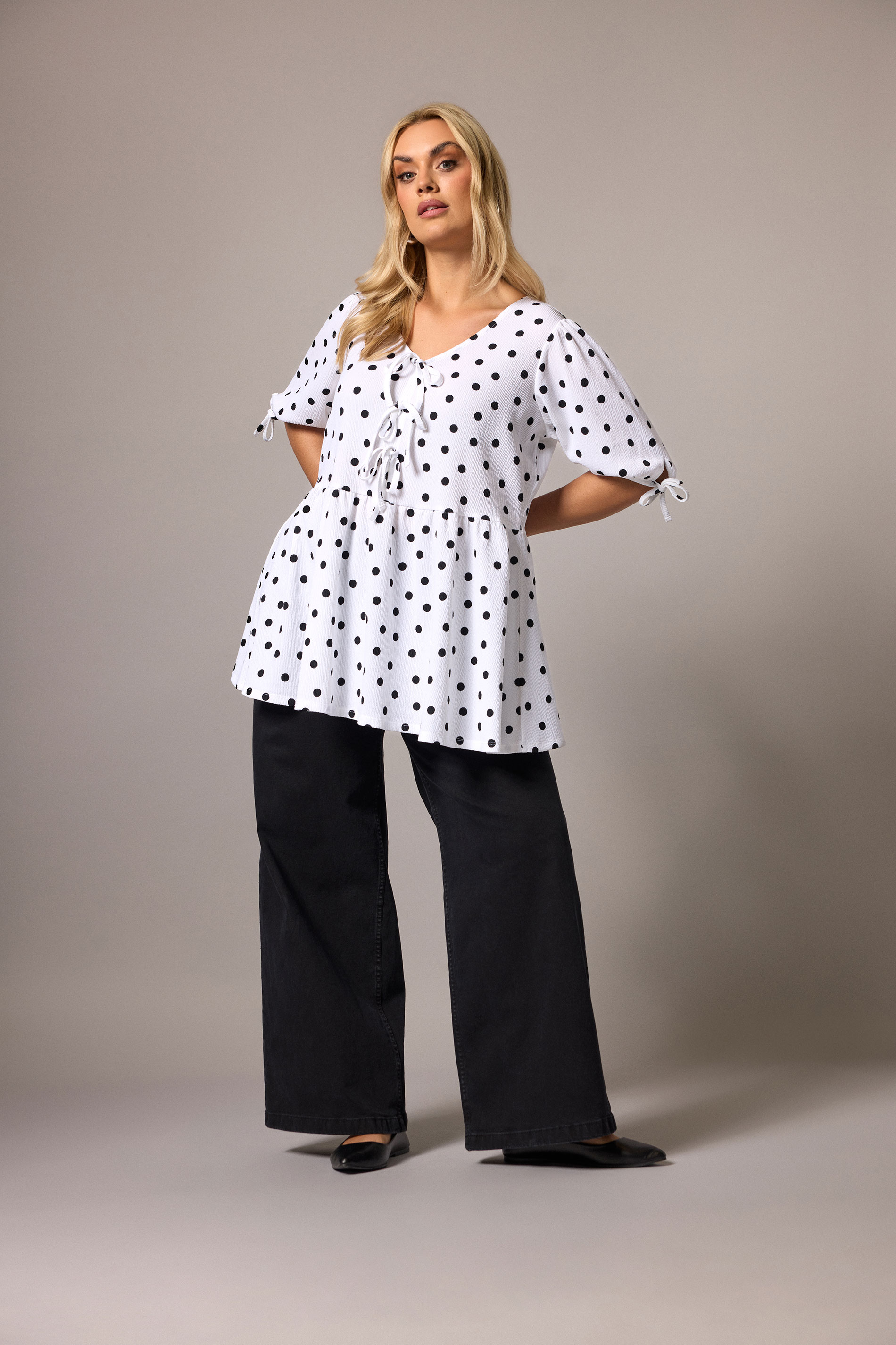 YOURS  Plus Size White Polka Dot Bow Front Peplum Top | Yours Clothing 1