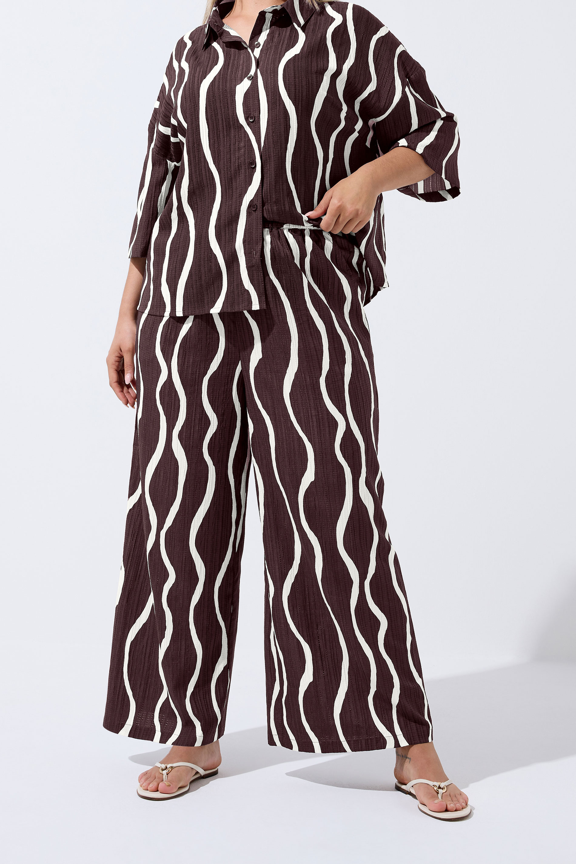 LIMITED COLLECTION Plus Size Brown Wavy Print Wide Leg Trousers | Yours Clothing 1
