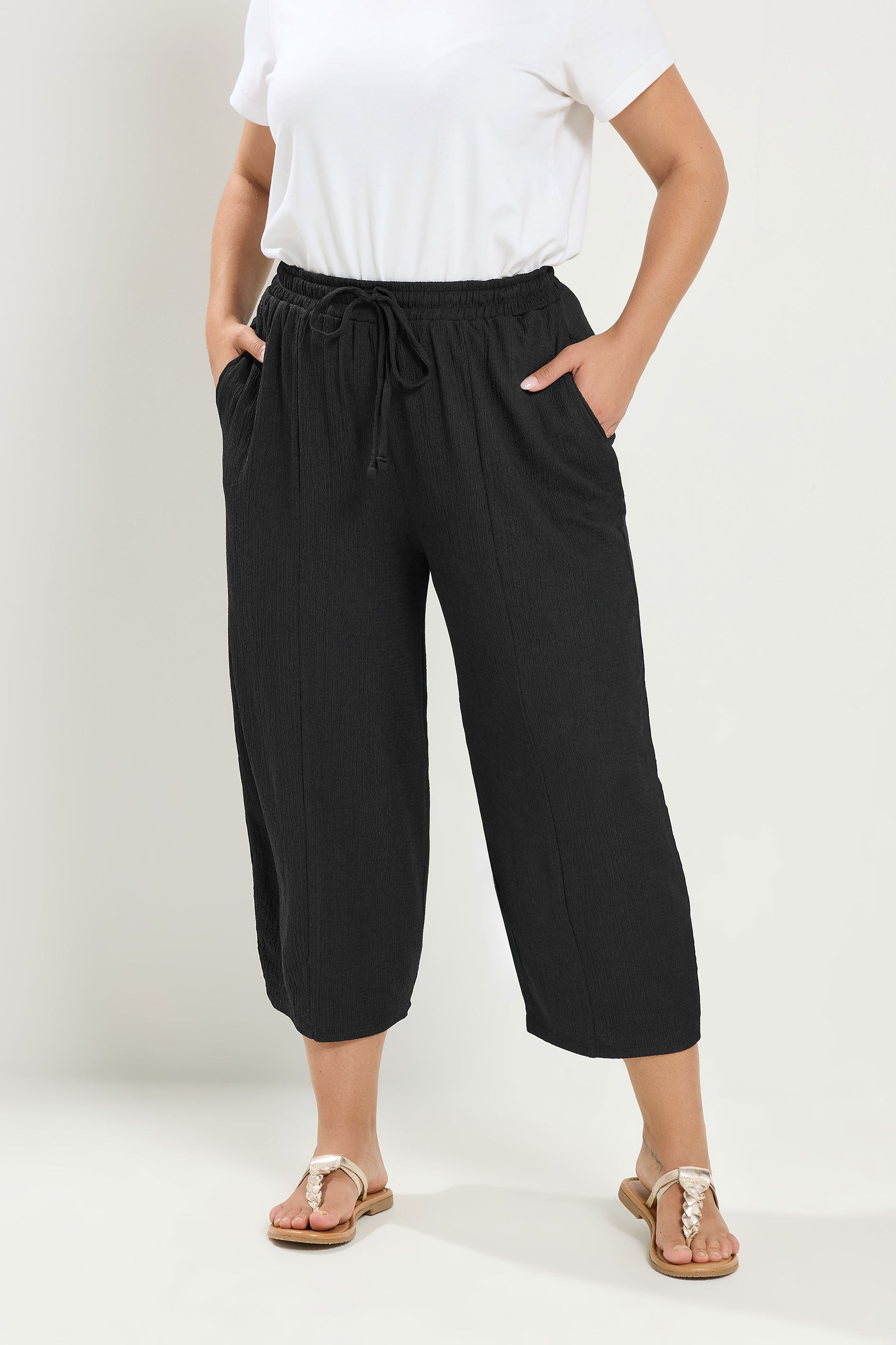 YOURS Plus Size Black Crinkle Barrel Trousers | Yours Clothing 1