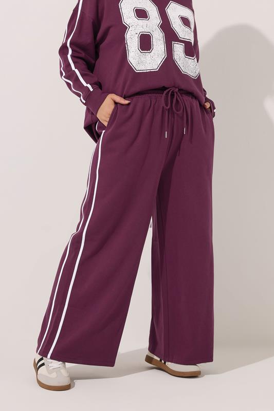 YOURS Plus Size Burgundy Red Side Stripe Wide Leg Joggers | Yours Clothing 1