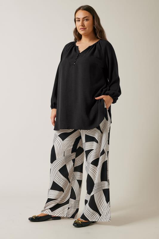 EVANS Plus Size Black Linear Print Wide Leg Trousers | Evans 2