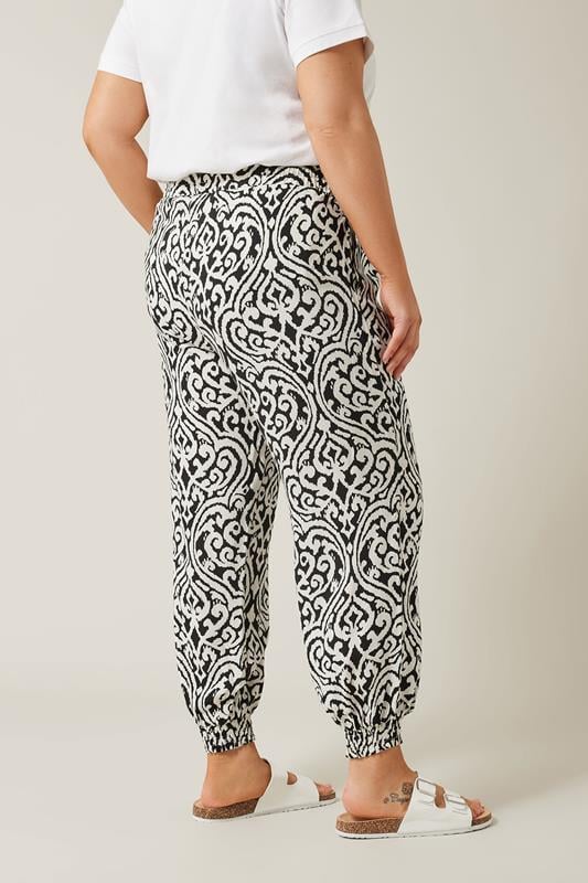 EVANS Plus Size Black Ikat Print Cuffed Harem Trousers | Evans  2