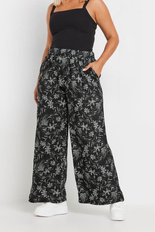 YOURS Plus Size Black Floral Print Elasticated Wide Leg Trousers | Yours Clothing 1