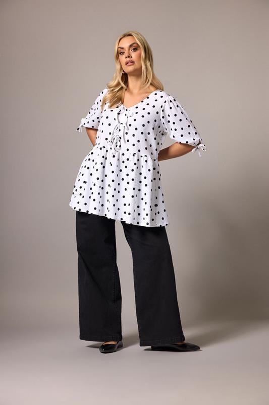 YOURS  Plus Size White Polka Dot Bow Front Peplum Top | Yours Clothing 1