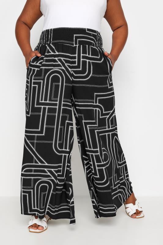 YOURS Plus Size Black Abstract Print Shirred Wide Leg Trousers | Yours Clothing 1