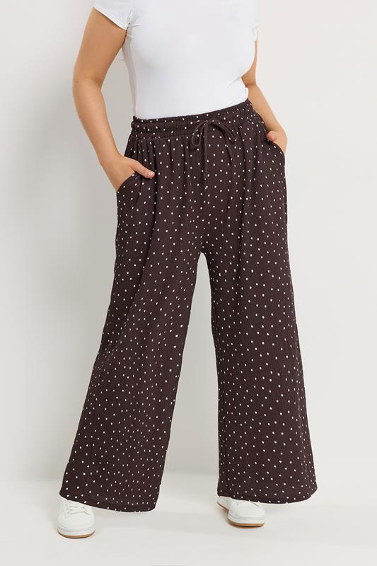 YOURS Plus Size Chocolate Brown Polka Dot Wide Leg Trousers | Yours Clothing 1