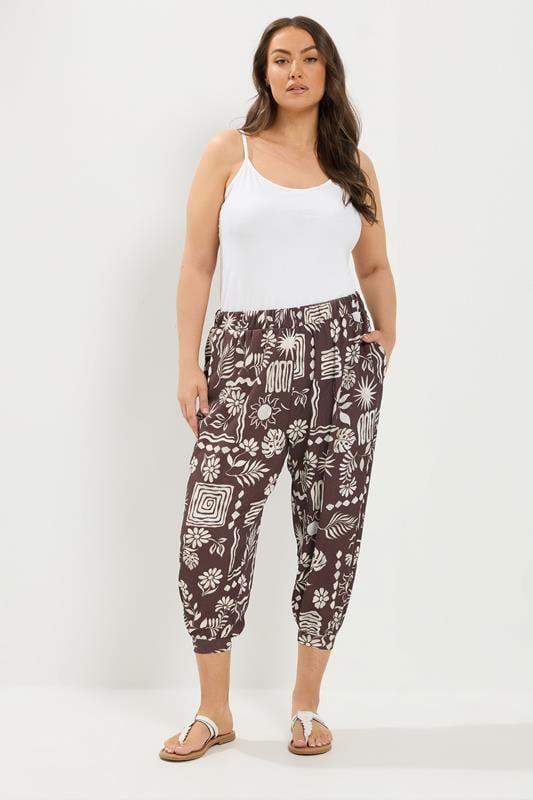 YOURS Plus Size Chocolate Brown Floral Cropped Harem Trousers | Yours Clothing 1