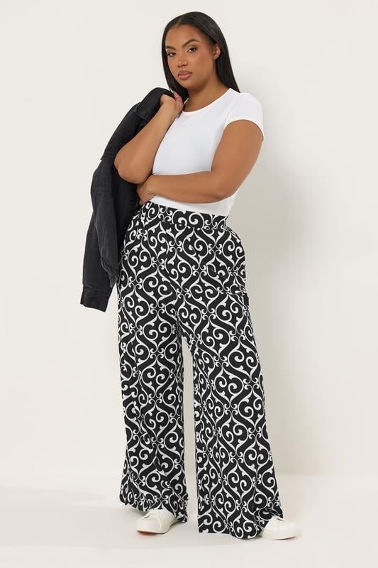 YOURS Plus Size Black Abstract Print Trousers | Yours Clothing 1