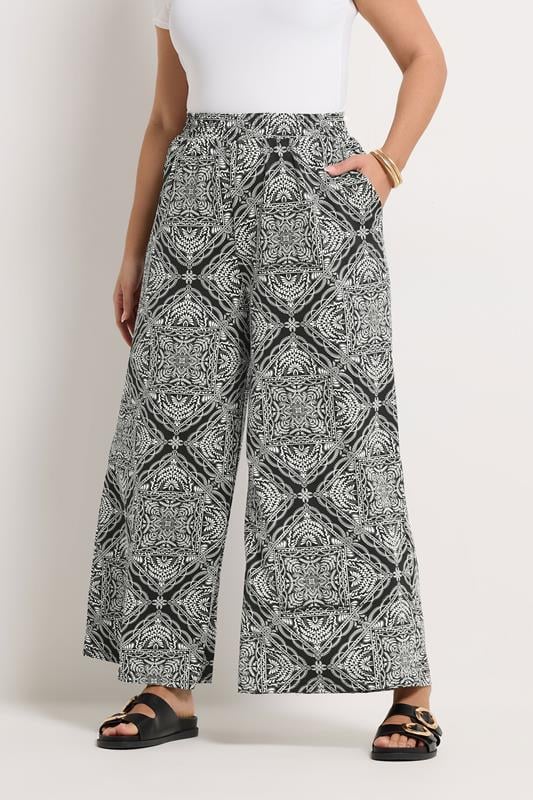 YOURS Plus Size Black Paisley Textured Wide Leg Trousers | Yours Clothing 1