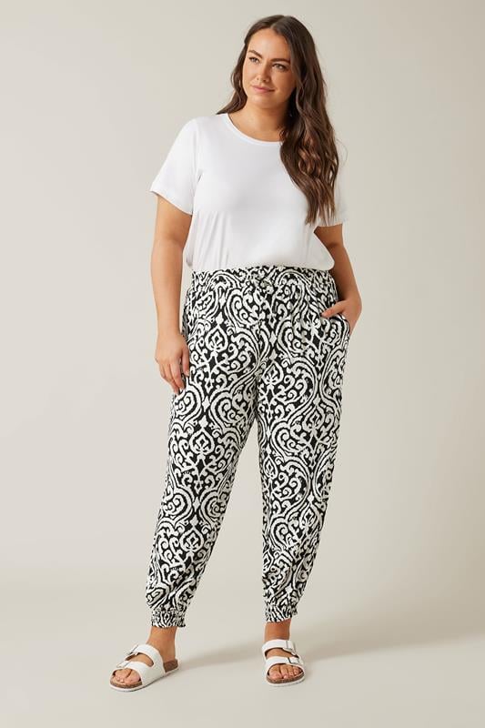 EVANS Plus Size Black Ikat Print Cuffed Harem Trousers | Evans  1