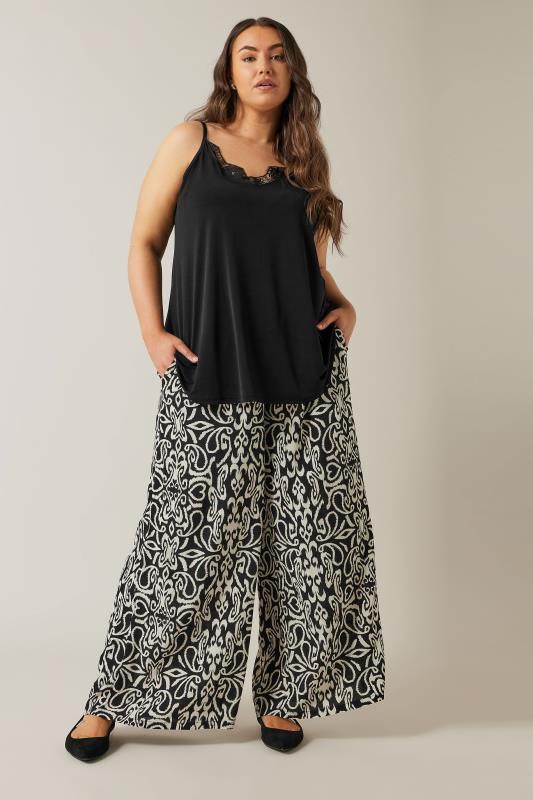 EVANS Plus Size Black & White Abstract Print Wide Leg Trousers | Evans 2