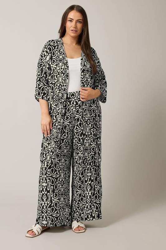 EVANS Plus Size Black & White Abstract Print Wide Leg Trousers | Evans 2