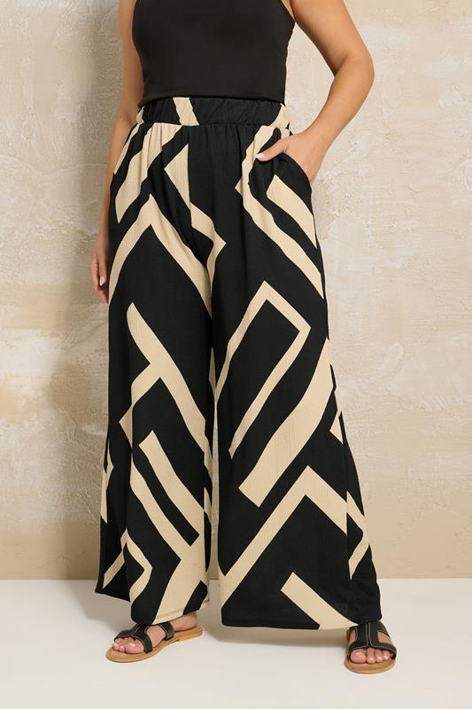 YOURS Plus Size Black Geometric Print Wide Leg Trousers | Yours Clothing 1