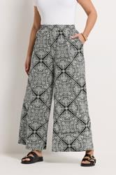 YOURS Plus Size Black Paisley Textured Wide Leg Trousers | Yours Clothing 1
