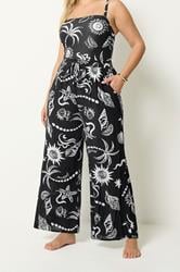 YOURS Plus Size Black Summer Print Crinkle Beachwear Wide Leg Trousers | Yours Clothing 1