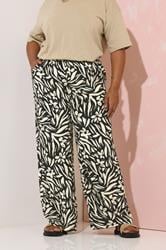 YOURS Plus Size Black Floral Print Wide Leg Trousers | Yours Clothing 1