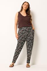 YOURS Plus Size Black Leaf Print Double Pleat Harem Trousers | Yours Clothing 1