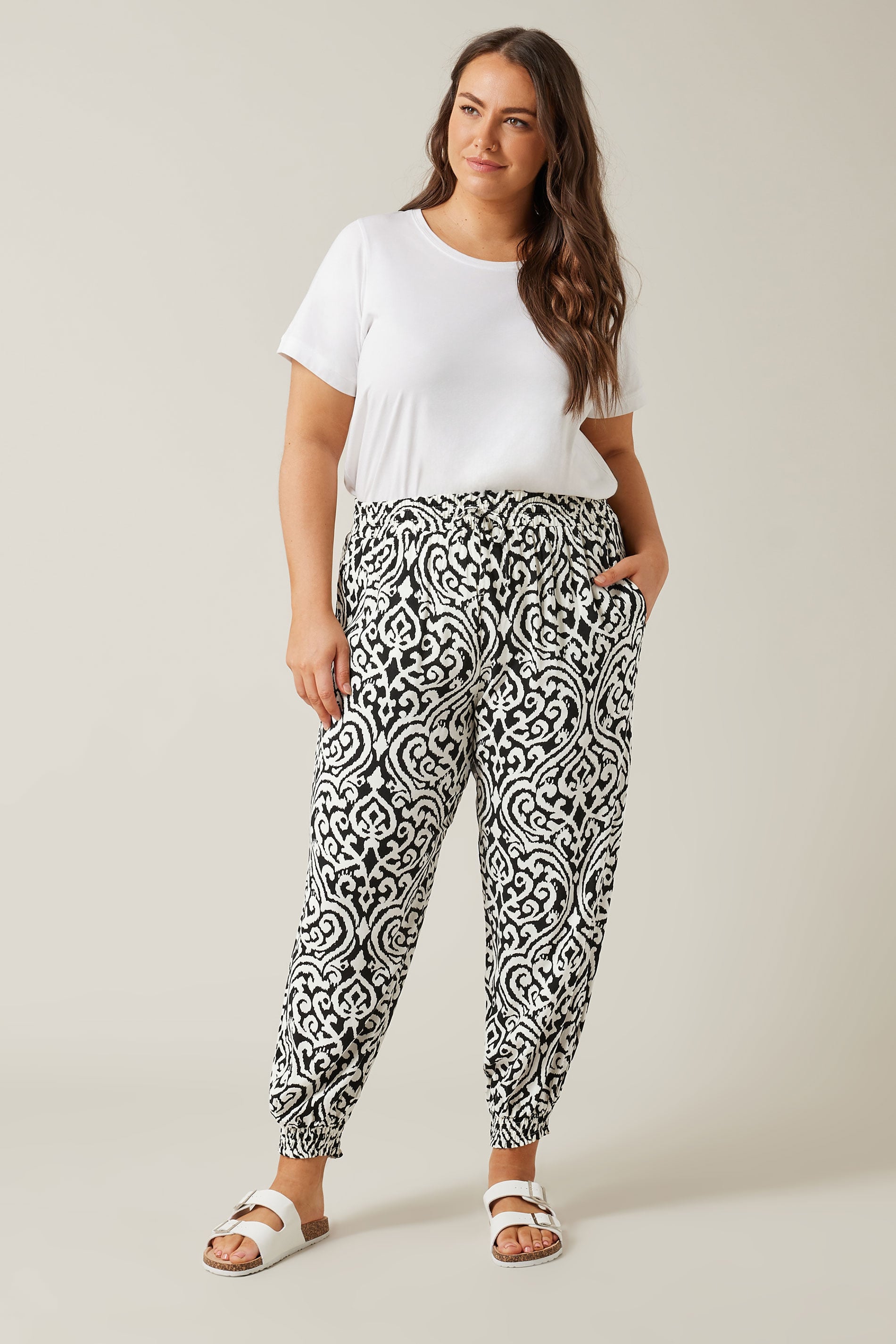 EVANS Plus Size Black Ikat Print Cuffed Harem Trousers | Evans  1