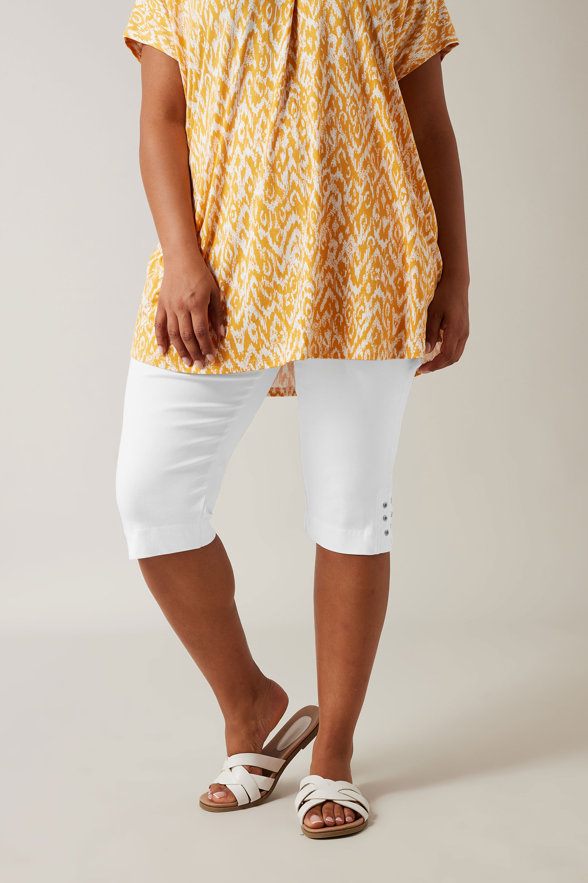 Evans White Cut Out Stud Cropped Leggings 1
